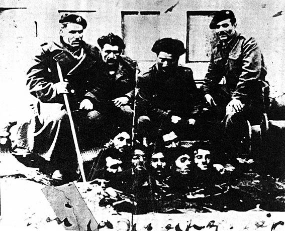 Greek fasicist (supported by the British Labour Government) with heads taken from communist partisans during the 1945-9 Civil War