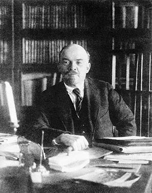 Lenin studying papers